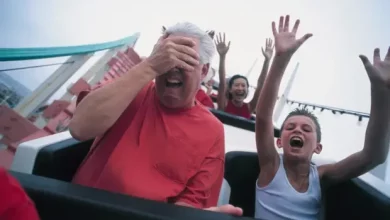 a person covering his eyes with his hand while a child is screaming